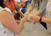 team working together to build marshmallow structure