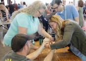 team working together to build marshmallow structure