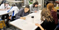 Newberg Graphic: SETH GORDON - NHS students work on white-board tables donated by Nike to the school district in September.